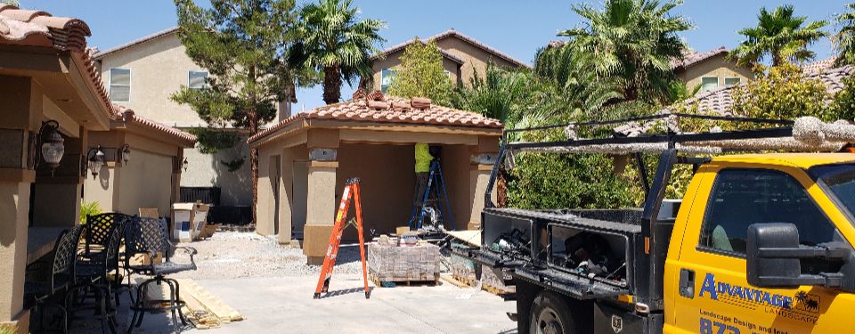 Construction worker working on the exterior of a house.