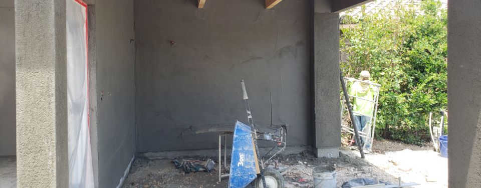 A commercial construction worker helping to remodel a commercial property.