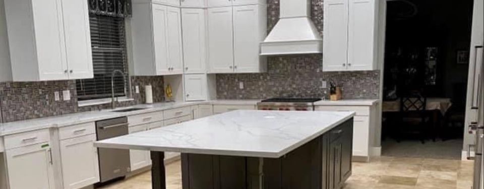 modern kitchen with white cabinets and island
